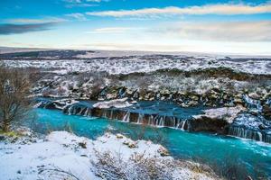 Hraunfossar, a waterfall formed by rivulets streaming over Hallmundarhraun, a lava field from volcano lying under the glacier Langjokull, and pour into the Hvita river, Iceland photo