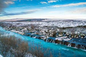 Hraunfossar, a waterfall formed by rivulets streaming over Hallmundarhraun, a lava field from volcano lying under the glacier Langjokull, and pour into the Hvita river, Iceland photo
