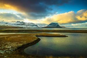 Kirkjufell, Church mountain, a 463 m high mountain on the north coast of Iceland's Snaefellsnes peninsula, near the town of Grundarfjordur, Iceland photo