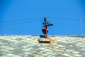 Power lines on the roof of the house. photo