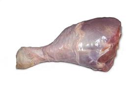 Turkey drumstick  in spices  on white background. Poultry meat. Turkey leg. Juicy meat is waiting to be cooked. photo