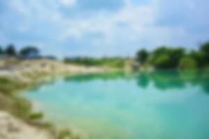 Blur of lake talaga biru background in summer, turqoise nature concept photo