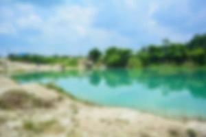 Blur of lake talaga biru background in summer, turqoise nature concept photo
