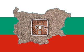 Outline map of Bulgaria with the image of the national flag. Manhole cover of the gas pipeline system inside the map. Collage. Energy crisis. photo