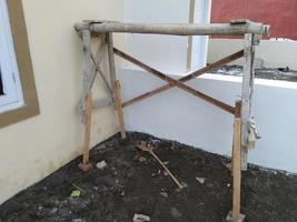 a simple ladder made of wood scraps, this ladder is made to reach a rather high place when painting or building a building photo