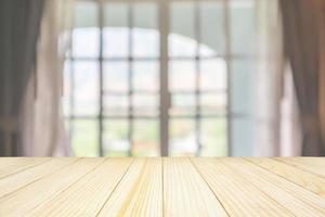 Empty wood table top with window curtain abstract blur background for product display photo