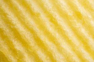 Potato chip texture background closeup photo