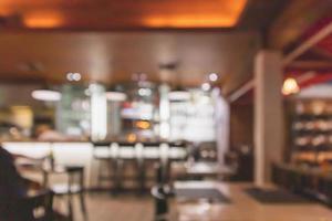 Cafe Restaurant interior with bar counter blur abstract background with bokeh light photo