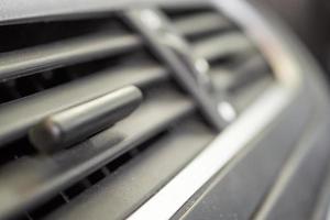 Air conditioner in modern compact car close up photo