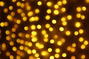 Abstract blur golden bokeh light Christmas holiday background photo