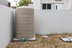 Water storage tank outside the house photo