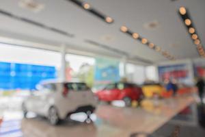 new cars in showroom blurred defocused background photo