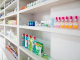 Close up of medicine bottles on shelves of drugs in the pharmacy photo