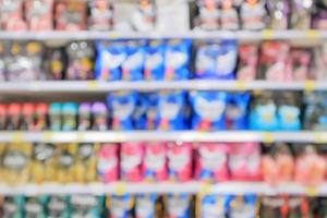 Abstract supermarket detergent shelves defocused blur background photo