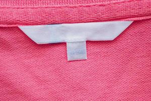 Blank white clothes label on new shirt photo