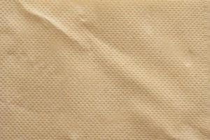 Fondo de textura de servilleta de papel tisú reciclado marrón abstracto foto
