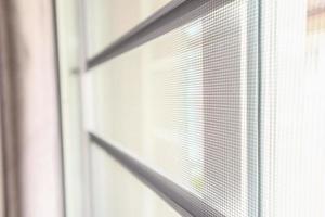 mosquito net wire screen on house window protection against insect photo