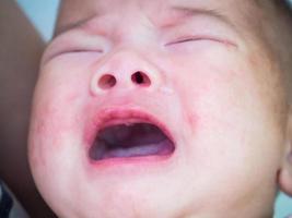 newborn baby girl crying photo