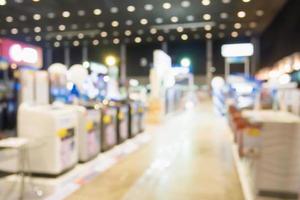 Washing machines in home appliance electronic department retail store blur background photo