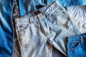 many denim blue jeans background photo