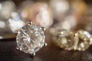 Jewelry diamond rings set on black background close up photo