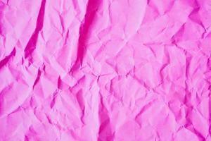 Fondo de textura de papel rosa arrugado foto