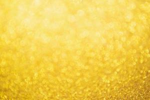 Abstract Gold glitter festive Christmas texture background blur with bokeh light photo