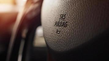 Safety airbag sign on car steering wheel with horn icon photo