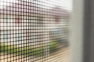 mosquito net wire screen on house window protection against insect photo