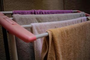 A portrait of a towel drying on a plastic clothesline photo