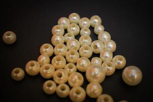 Photos of unique knick knacks made of pearls in perforated
