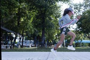 Women are jogging to maintain a healthy body. Technological concepts of running for good health. photo