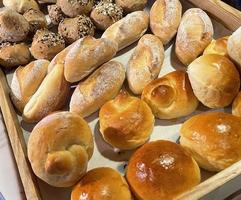 Fresh Baked soft bread rolls and hard bread rolls. Warm Fresh Buttery Rolls. good for your multimedia content background photo