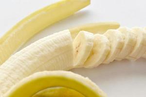 Banana slices on white background. Healthy and dietary food. photo