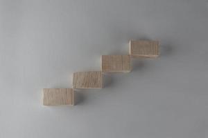 Wood block stacking as step stair. Business concept for growth success process. photo