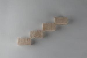 Wood block stacking as step stair. Business concept for growth success process. photo