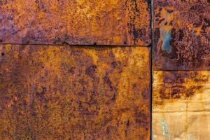 Rusted flat composite nailed metal sheets surface background and texture. photo