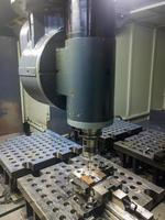 large cnc milling rotary head making measurements with contact probe in automatic mode photo