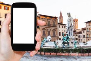 tourist photographs Piazza signoria with Fountain photo