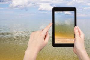 calm surface of Azov Sea on tablet pc photo