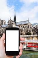 tourist photographs cathedral Notre Dame de Paris photo