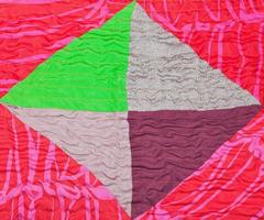 geometric ornament of silk patchwork quilt photo
