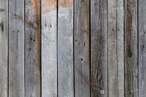 Fondo y textura de la superficie de la pared de tablones de madera seca gris foto