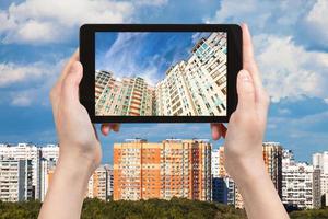 photographs picture of apartment houses on tablet photo