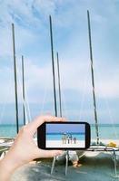 tourist taking photo of Atlantic ocean coast