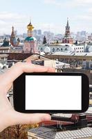 smartphone with cut out screen and Moscow center photo