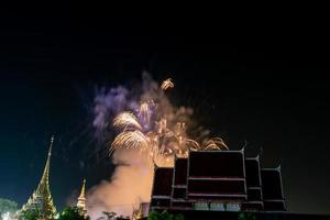 fireworks on the river in the dark sky photo