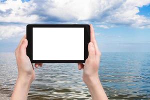 tourist photographs of Azov Sea on tablet pc photo