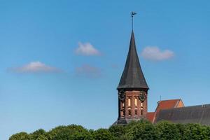 Clock tower of Konigsberg Cathedral. Brick Gothic-style monument in Kaliningrad, Russia. Immanuel Kant island. photo