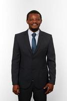 Smiling african american black man in business suit isolated on white background photo